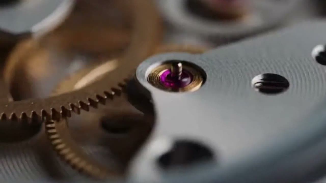 Close-up of the gears and jewelled bearing inside a mechanical watch movement